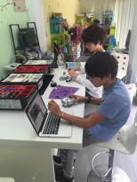 Kids working on Mindstorms EV3 programming